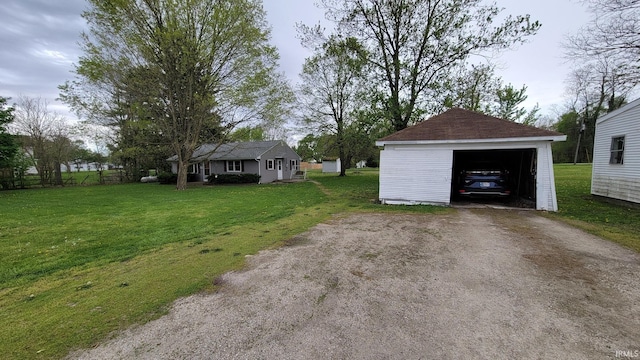 detached garage featuring driveway