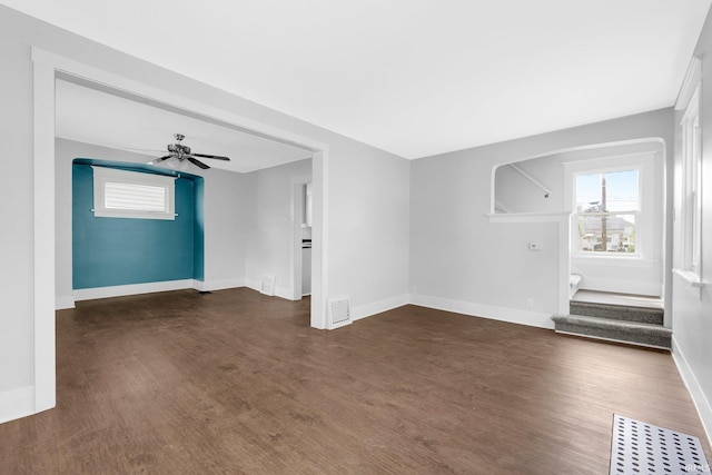 2922 Plaza Dr, Fort Wayne, IN 46806 - unfurnished living room with baseboards, dark wood finished floors, ceiling fan, and visible vents