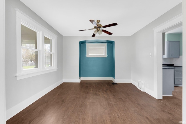 2922 Plaza Dr, Fort Wayne, IN 46806 - empty room with a ceiling fan, baseboards, dark wood finished floors, and visible vents