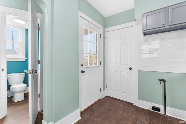 2922 Plaza Dr, Fort Wayne, IN 46806 - doorway to outside featuring baseboards and dark wood-style flooring