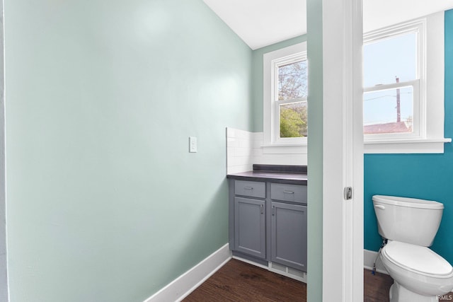 2922 Plaza Dr, Fort Wayne, IN 46806 - bathroom with baseboards, toilet, and wood finished floors