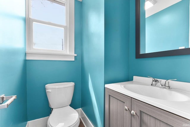 2922 Plaza Dr, Fort Wayne, IN 46806 - bathroom with baseboards, toilet, and vanity