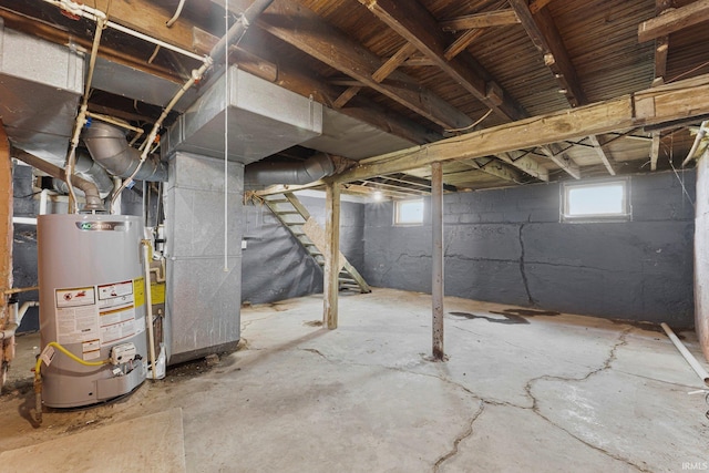 2922 Plaza Dr, Fort Wayne, IN 46806 - below grade area with water heater, plenty of natural light, stairway, and heating unit
