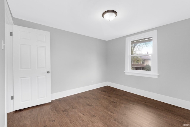 2922 Plaza Dr, Fort Wayne, IN 46806 - spare room with baseboards and dark wood finished floors