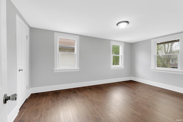 2922 Plaza Dr, Fort Wayne, IN 46806 - spare room featuring dark wood-style flooring and baseboards