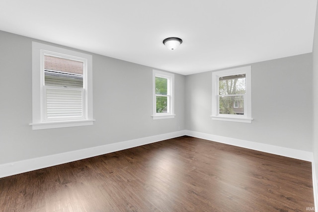2922 Plaza Dr, Fort Wayne, IN 46806 - empty room featuring baseboards and dark wood-type flooring