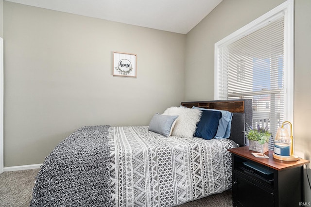 carpeted bedroom with baseboards