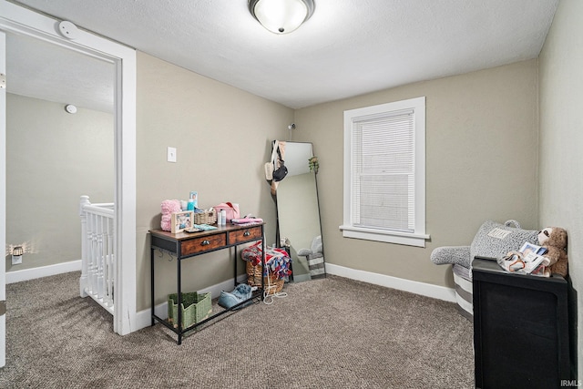 rec room featuring carpet flooring and baseboards