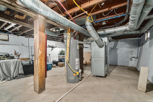 unfinished basement featuring heating unit and gas water heater