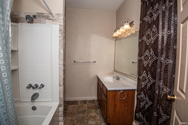 bathroom featuring baseboards and vanity