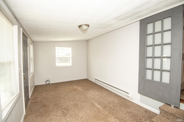 carpeted empty room featuring baseboards and a baseboard radiator