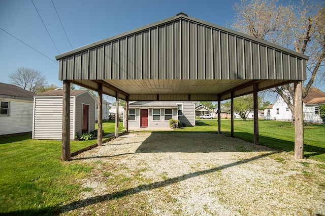 exterior space with a detached carport and a storage shed