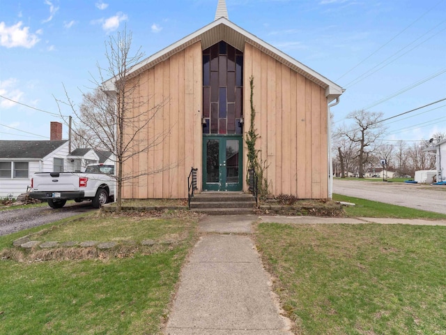 view of outbuilding featuring entry steps and french doors
