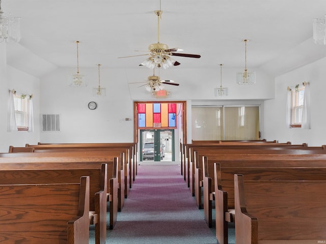 interior space with ceiling fan, vaulted ceiling, and a healthy amount of sunlight