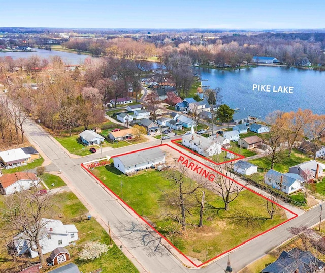 bird's eye view with a water view and a residential view