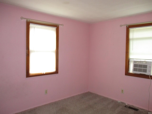 carpeted empty room featuring cooling unit