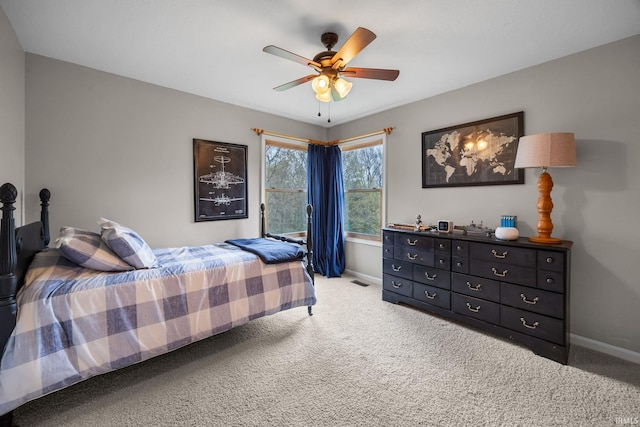 bedroom with baseboards, a ceiling fan, and carpet flooring