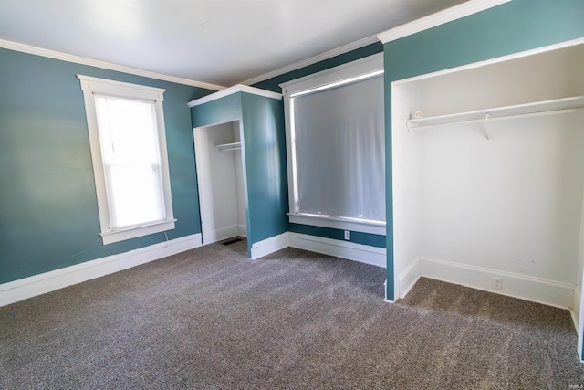 unfurnished bedroom featuring carpet floors, ornamental molding, and baseboards