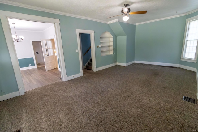 unfurnished bedroom with carpet floors, ornamental molding, baseboards, and visible vents