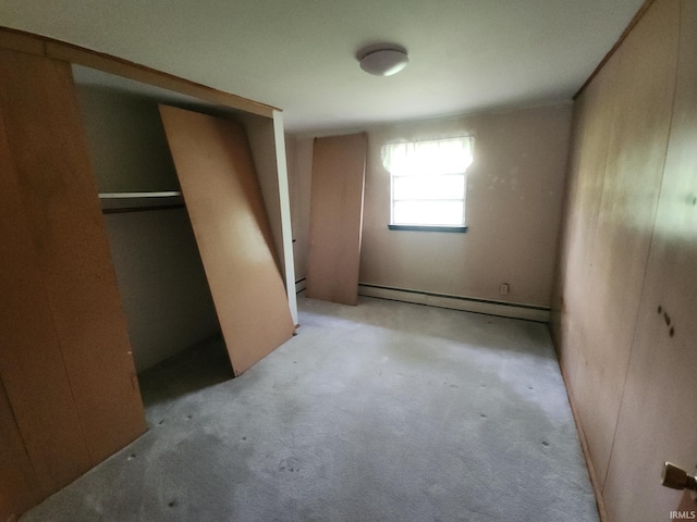 2708 Elmwood Dr, Logansport, IN 46947 - unfurnished bedroom with carpet floors and a baseboard heating unit