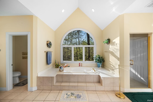 bathroom featuring a garden tub, visible vents, toilet, tile patterned floors, and vaulted ceiling