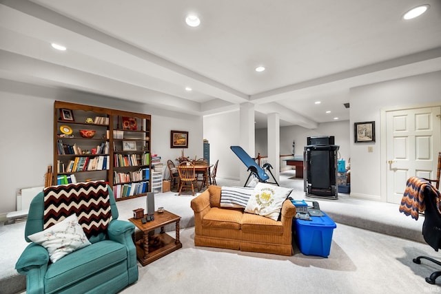 carpeted living room featuring recessed lighting, baseboards, and ornate columns