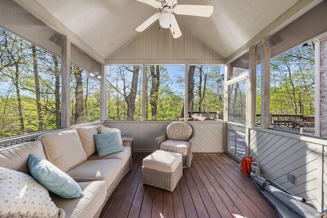 sunroom / solarium with ceiling fan and an outdoor hangout area