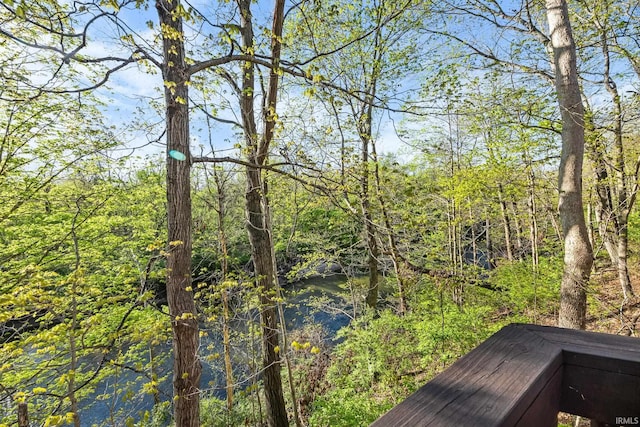 exterior space featuring a wooded view