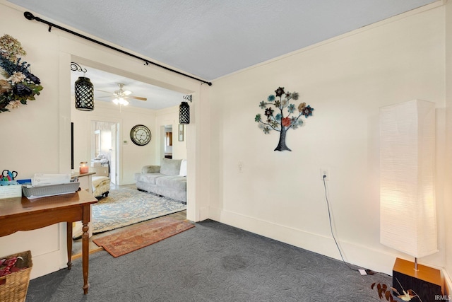 interior space featuring carpet flooring and ceiling fan