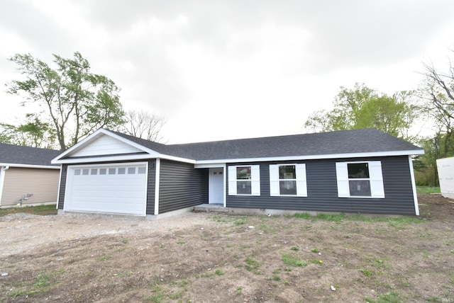 1022 E 8th St, Fowler, IN 47944 - ranch-style home featuring driveway, roof with shingles, and a garage