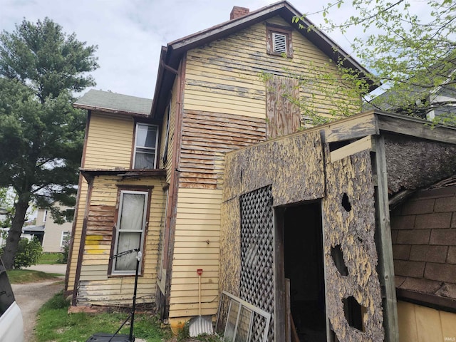 1217 Smead St, Logansport, IN 46947 - view of home's exterior featuring a chimney