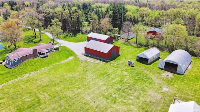 birds eye view of property with a wooded view