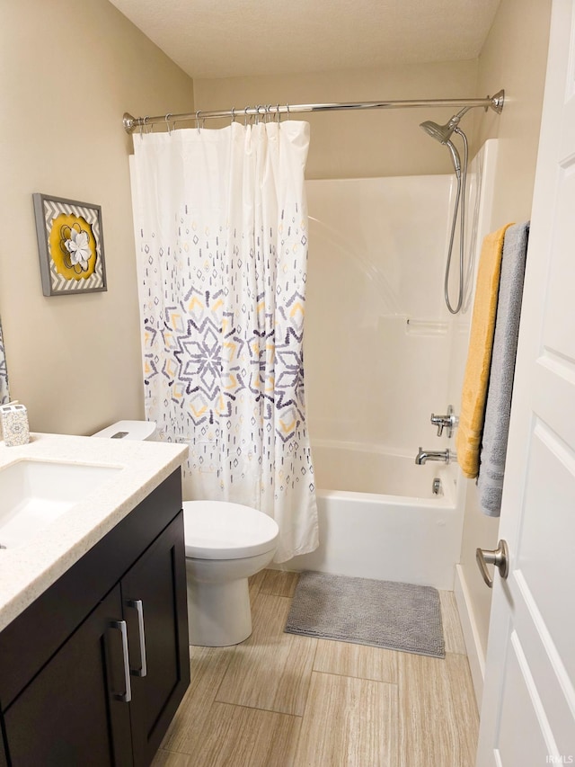 full bath featuring vanity, shower / bathtub combination with curtain, and toilet