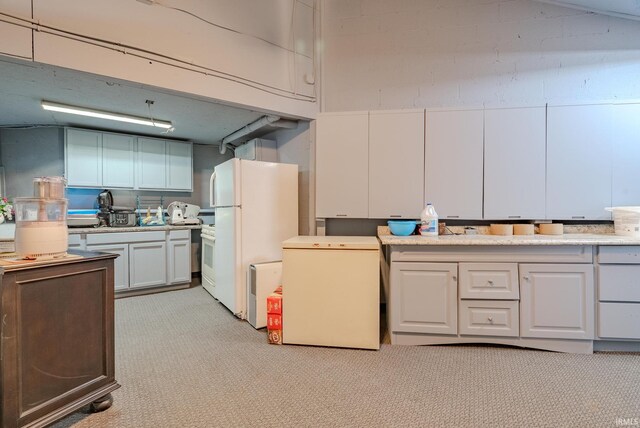 479 W 250 S, Wabash, IN 46992 - kitchen with freestanding refrigerator, refrigerator, light carpet, light countertops, and white cabinetry