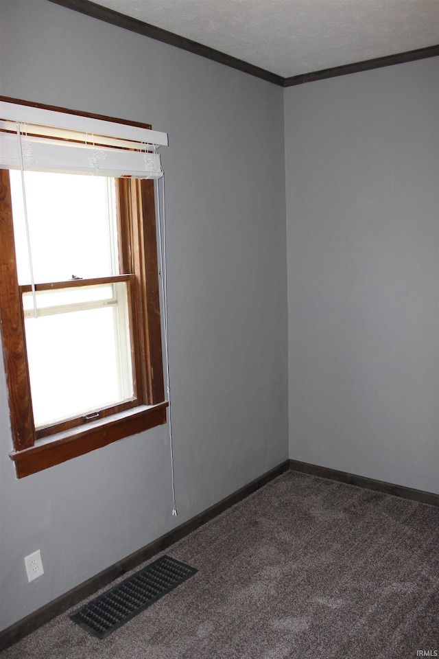 1614 Longley Ave, South Bend, IN 46628 - carpeted empty room with baseboards, ornamental molding, and visible vents