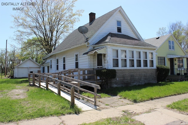 1614 Longley Ave, South Bend, IN 46628 - bungalow-style home with a chimney, an outdoor structure, a detached garage, a front yard, and roof with shingles