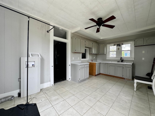 kitchen with crown molding, a ceiling fan, gray cabinetry, and light countertops