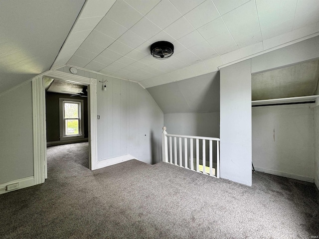 bonus room with carpet floors and lofted ceiling