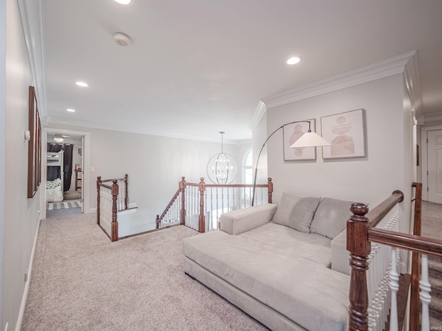 carpeted living area featuring crown molding, recessed lighting, baseboards, and a chandelier