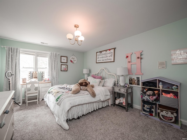 carpeted bedroom with visible vents and a notable chandelier
