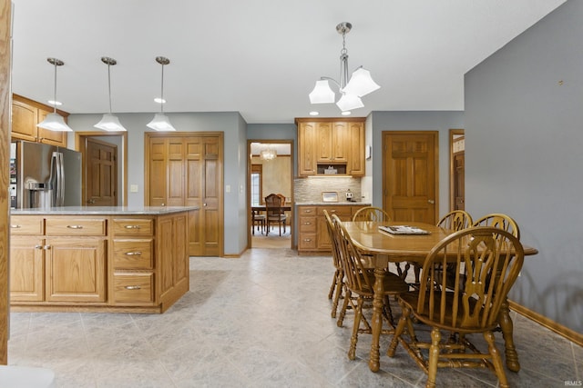 dining room with recessed lighting, baseboards, an inviting chandelier, and light tile patterned flooring