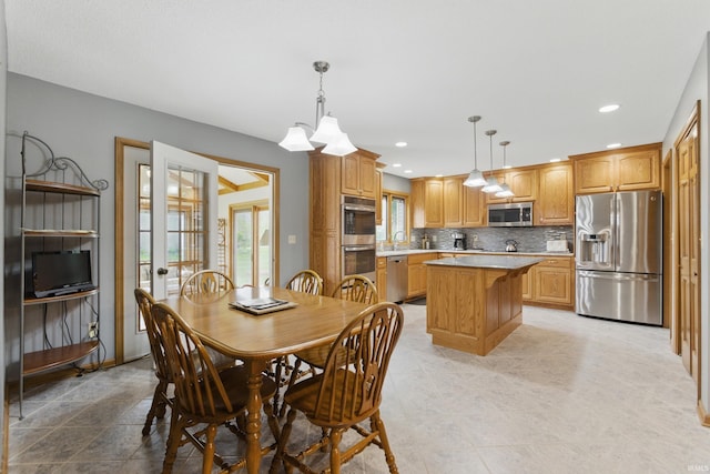 dining space featuring light tile patterned floors and recessed lighting