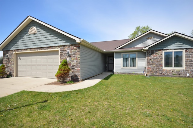 view of front of house with an attached garage, a front yard, driveway, and stone siding
