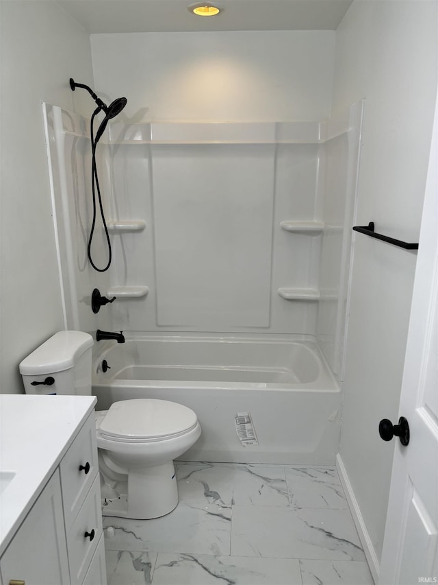 bathroom with vanity, marble finish floor, toilet, baseboards, and shower / bath combination