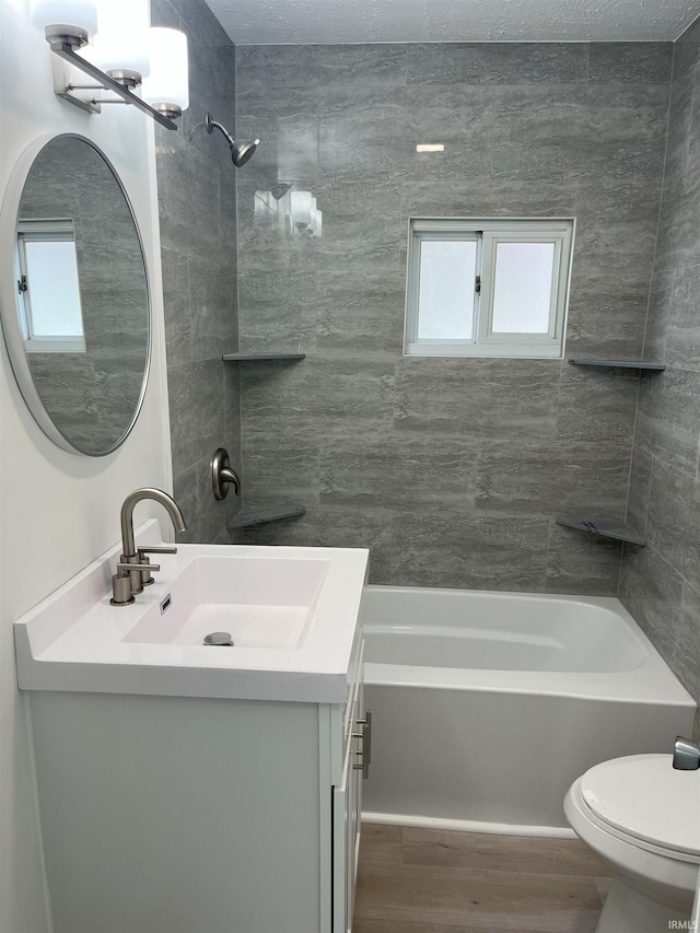 1134 N Iowa St, South Bend, IN 46628 - full bathroom with toilet, shower / washtub combination, wood finished floors, and vanity