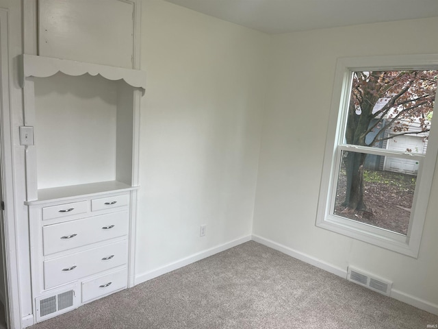 1134 N Iowa St, South Bend, IN 46628 - unfurnished bedroom featuring baseboards, carpet, and visible vents