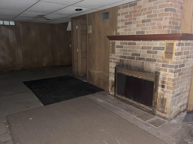 1134 N Iowa St, South Bend, IN 46628 - finished below grade area featuring a brick fireplace and wood walls