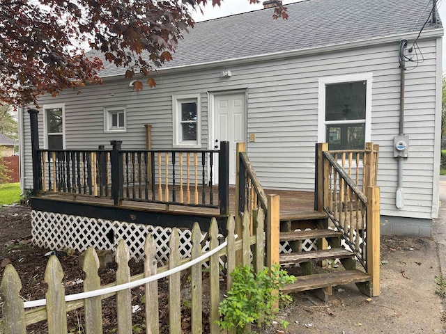 1134 N Iowa St, South Bend, IN 46628 - back of house featuring a shingled roof and a wooden deck