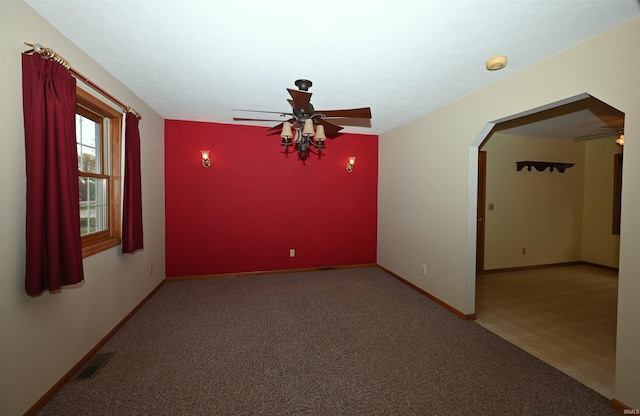 800 E Oak View Est, Winamac, IN 46996 - carpeted spare room featuring visible vents, arched walkways, baseboards, and ceiling fan