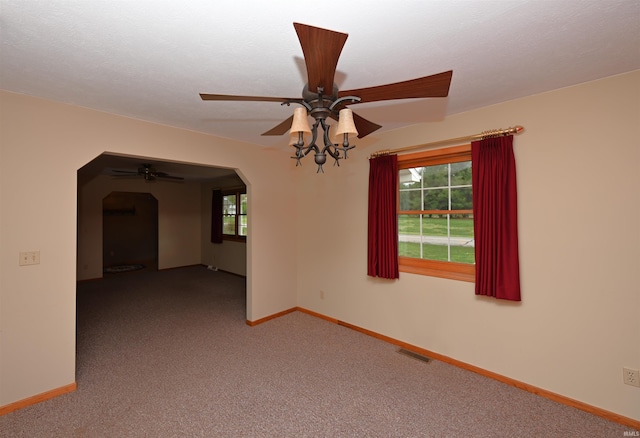 800 E Oak View Est, Winamac, IN 46996 - carpeted spare room with visible vents, a ceiling fan, arched walkways, and a healthy amount of sunlight